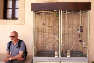 Yash and caged birds, Gonia Monastery, Colymbari, Crete, '23.