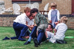 Rob, friends and assembled Cousins attack Mike.