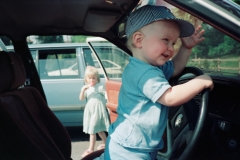 Paul at the wheel, Rebekah looks on.