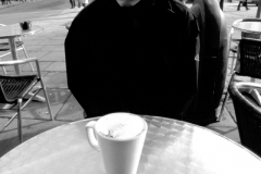 Paul contemplating his coffee.