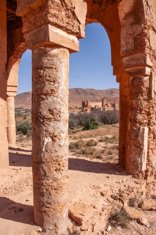 Kasbah through pillars of ruin, Taliouine, '19.