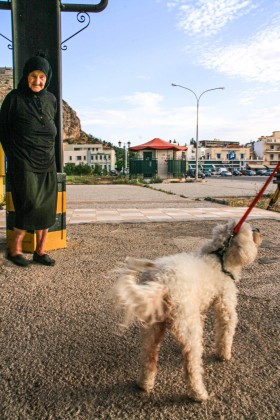 Old lady and dog, Nafplio, Greece.